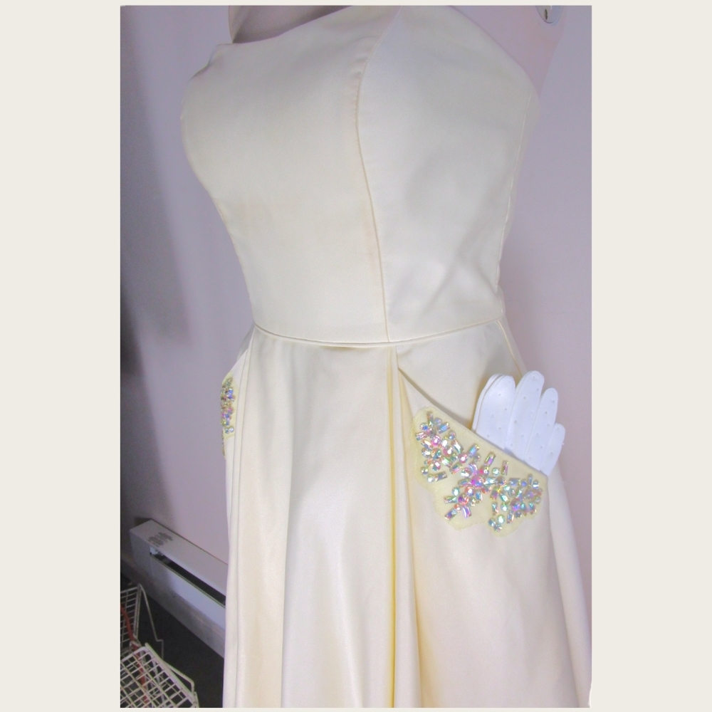 Full length Formal Dress size 5 . Strapless with  Embellishments  and Pockets .